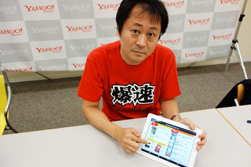 『iPad』を手に『爆買いの日』の概要を説明してくれる鈴木さん